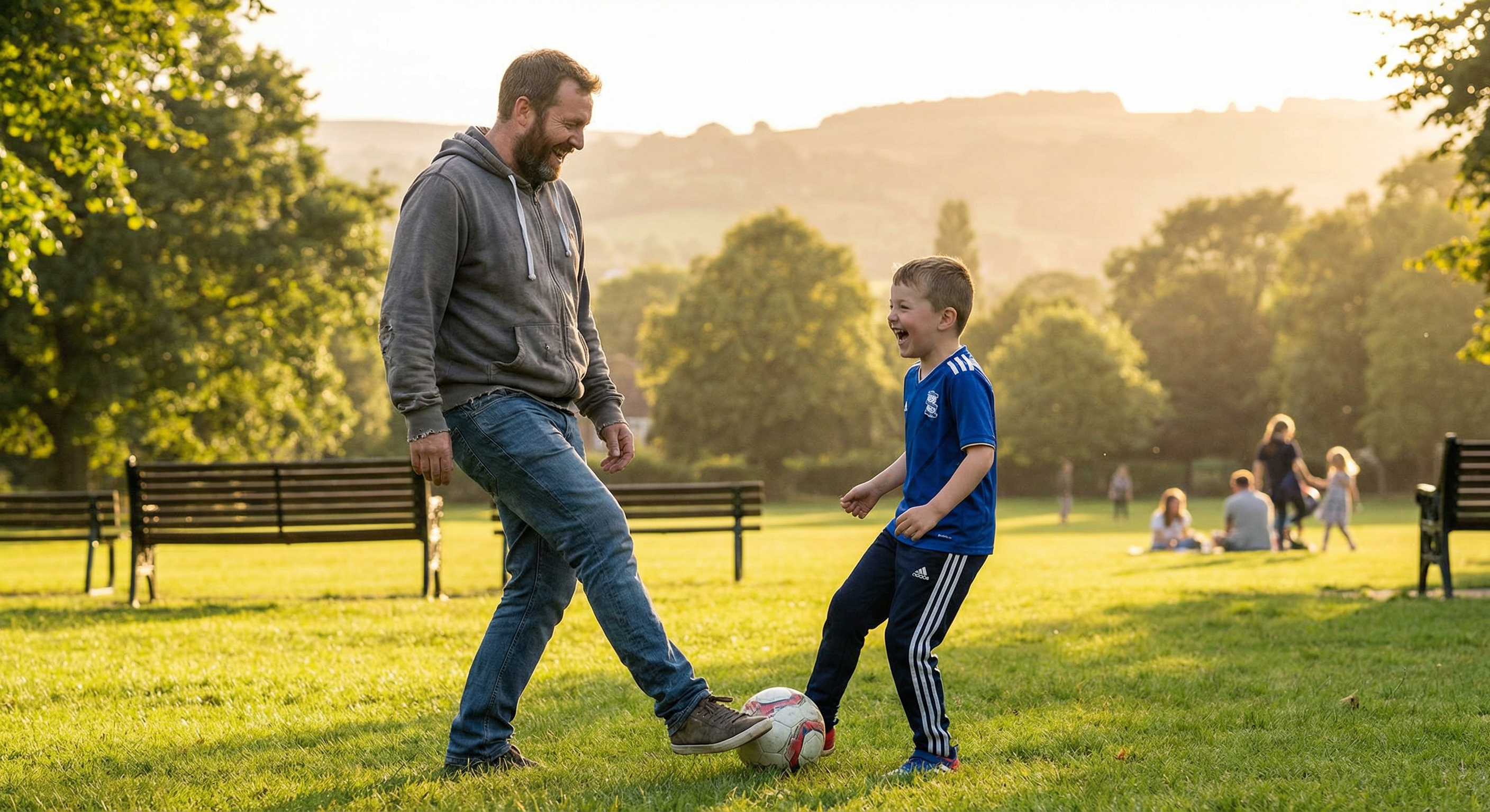 Dad playing football with son